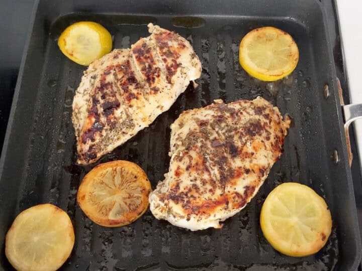 Grill the chicken on the second side.