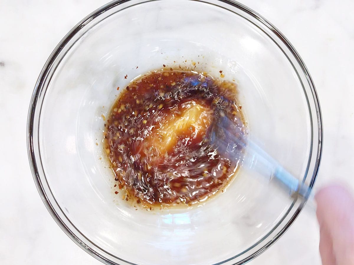 Mixing the dressing.