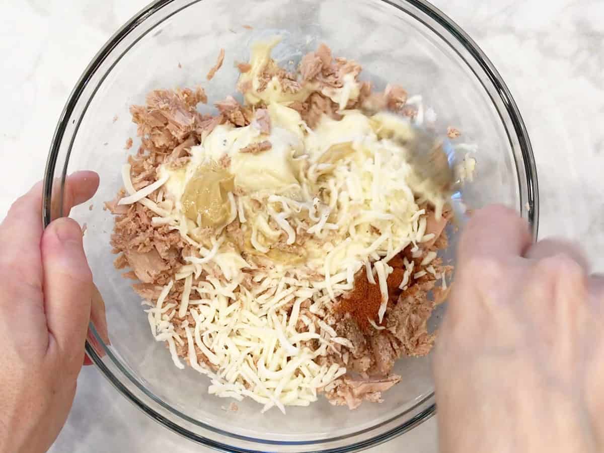 Mixing the ingredients in a bowl.