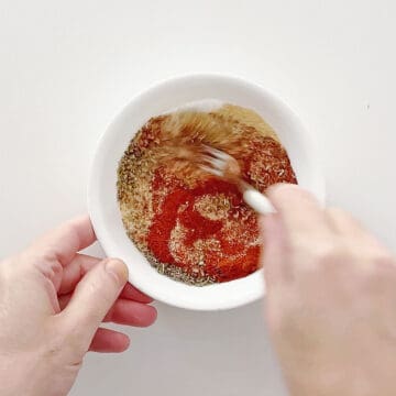 Mixing the spices in a bowl.