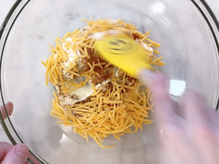 Mixing the sauce in a bowl.