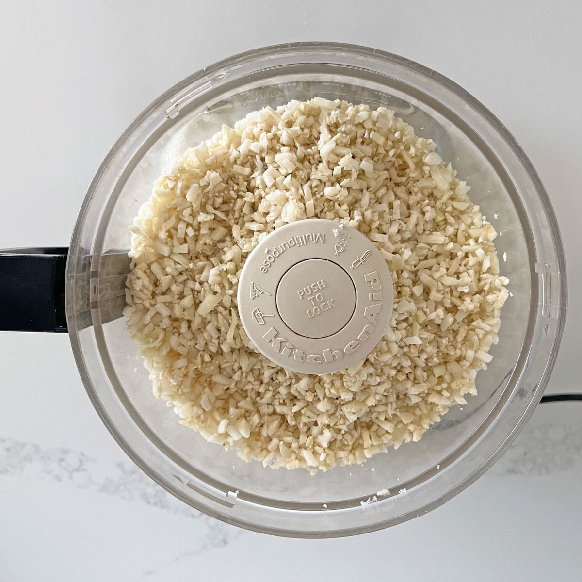 Riced cauliflower in the food processor.
