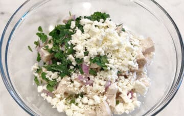 The salad ingredients were added to a bowl.