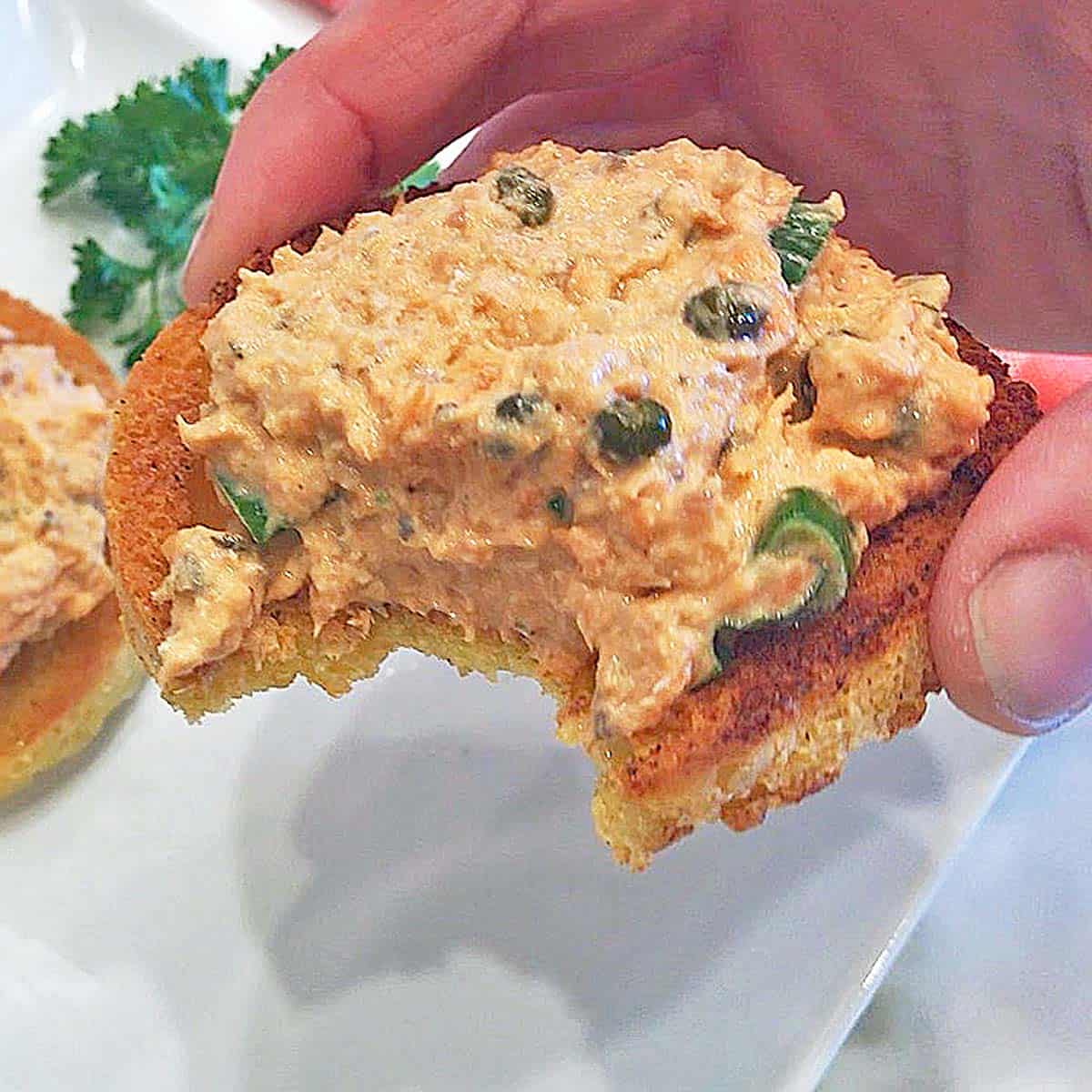 The salad is served on toasted bread.