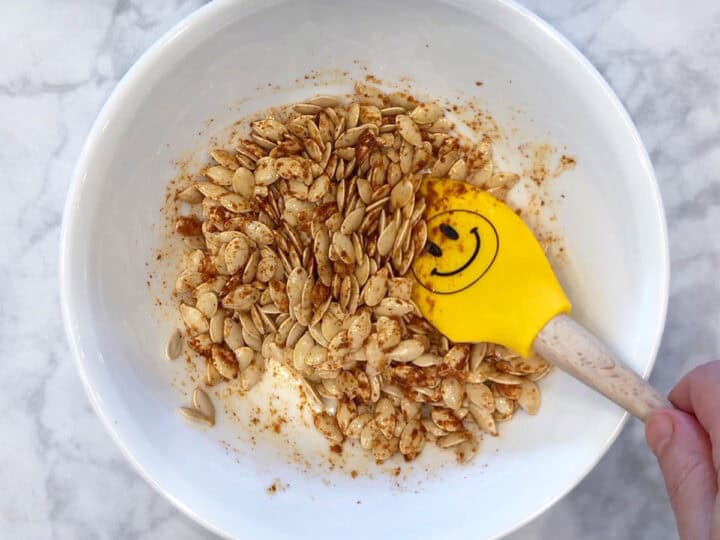 Seasoning the seeds.