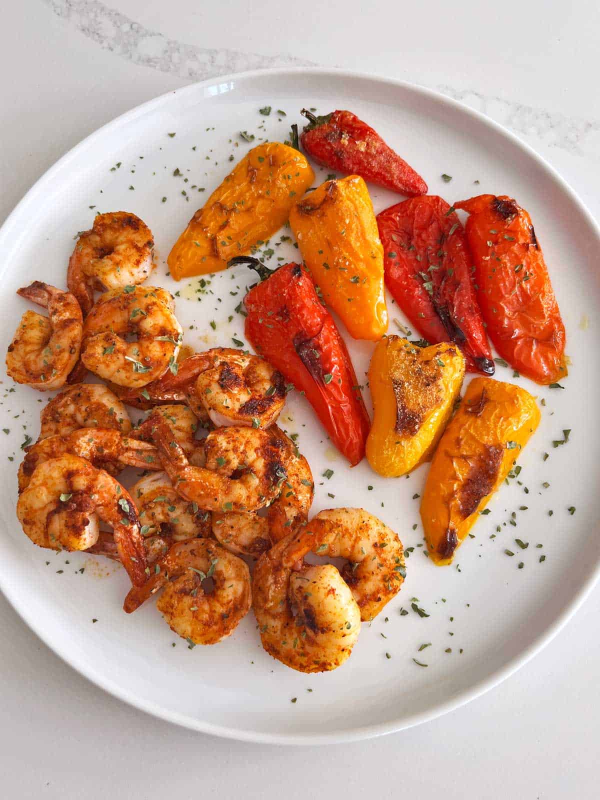 Mini peppers are served with shrimp.
