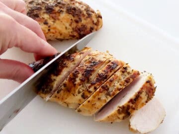 Slicing the chicken.