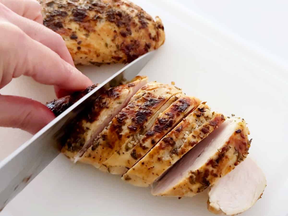 Slicing the chicken.