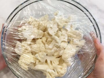 Wrapping the bowl with plastic wrap.