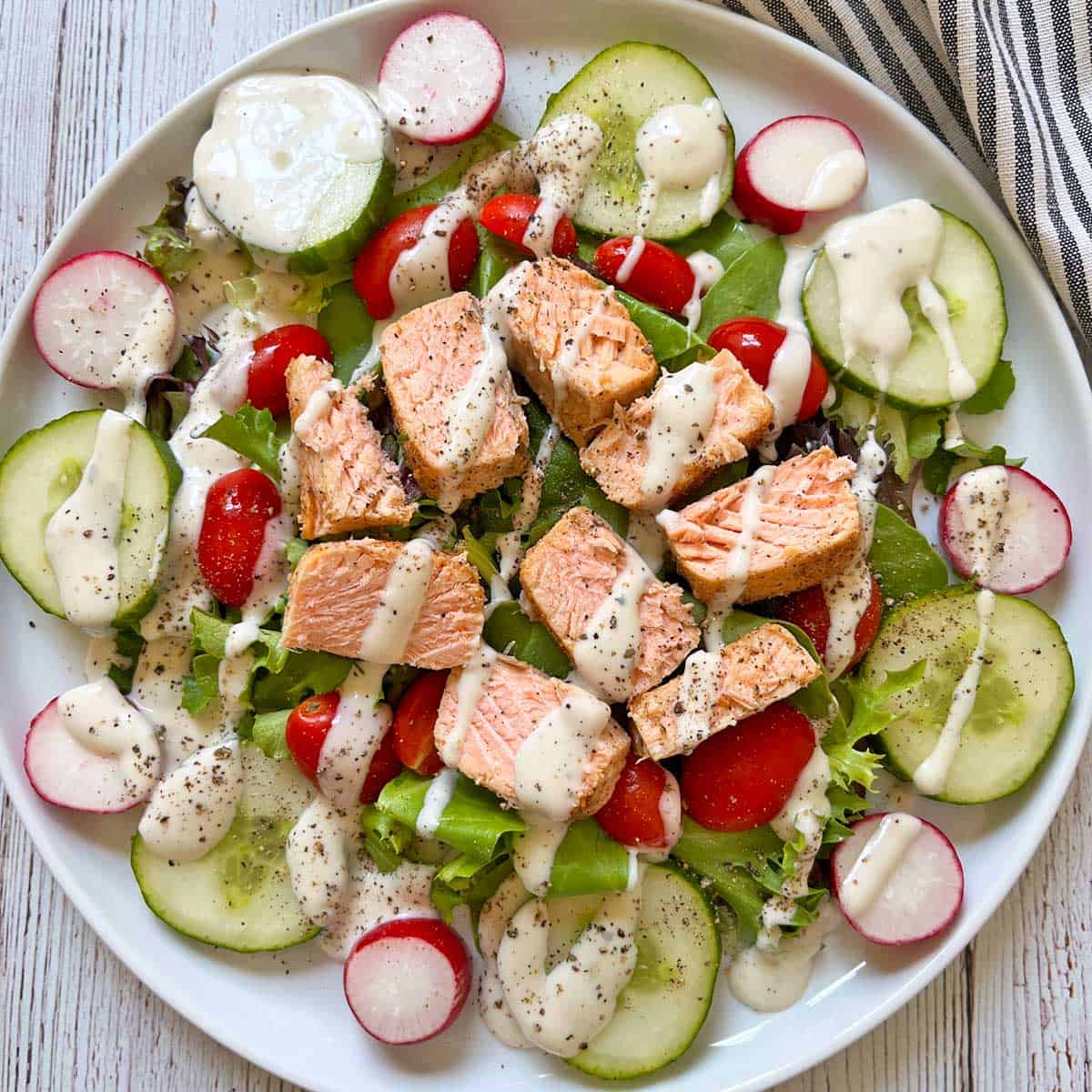 Broiled salmon leftovers in a salad.