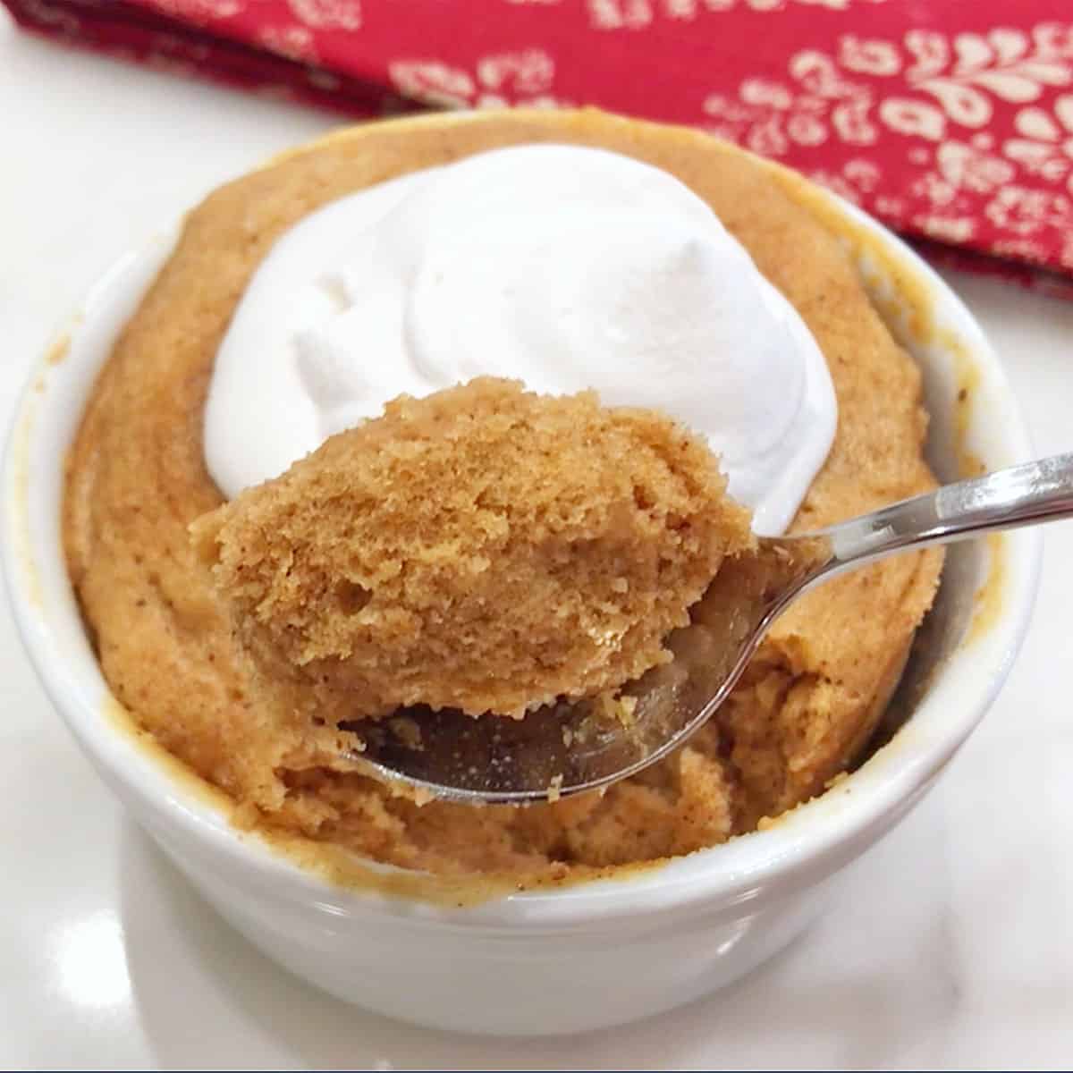A spoon showing off the cake's tender crumb.
