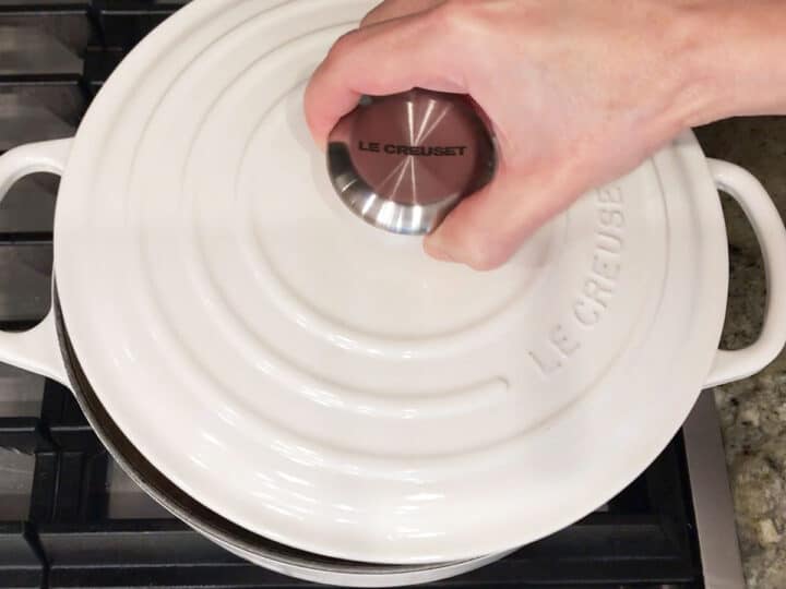 Covering the pot with a lid.