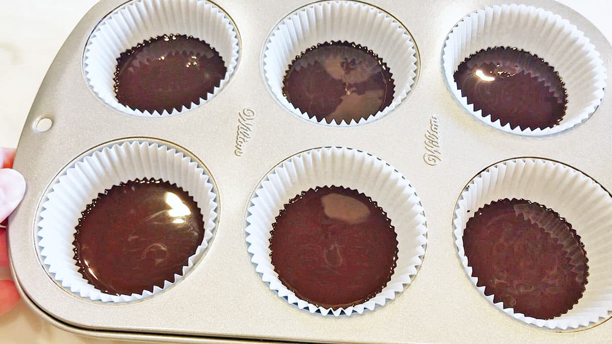 The first chocolate layer was added to the paper liners.