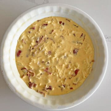 The quiche is ready for the oven.