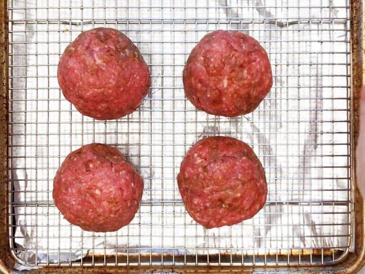 The Scotch eggs are in the pan, ready for the oven.