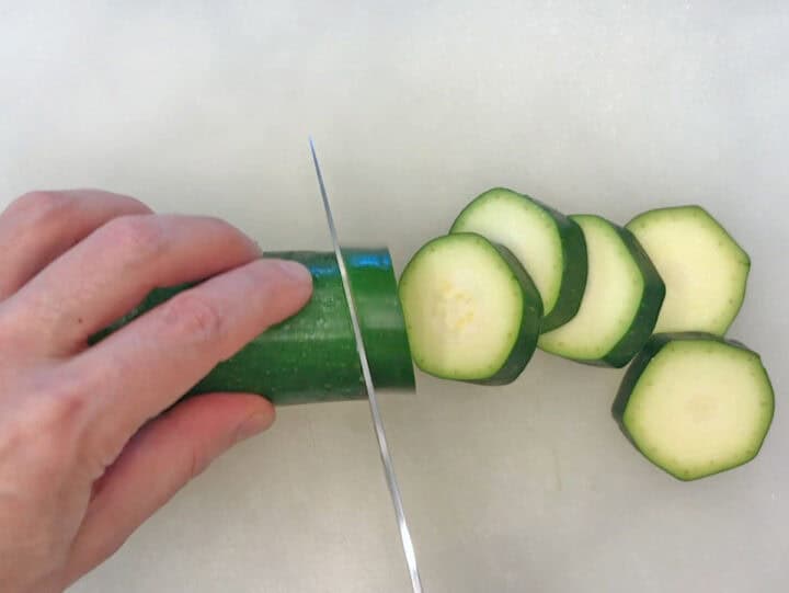 Slicing the zucchini.