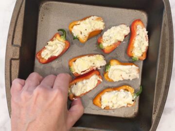 Arranging the peppers in the baking dish.