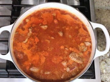 Bringing the stew to a boil.