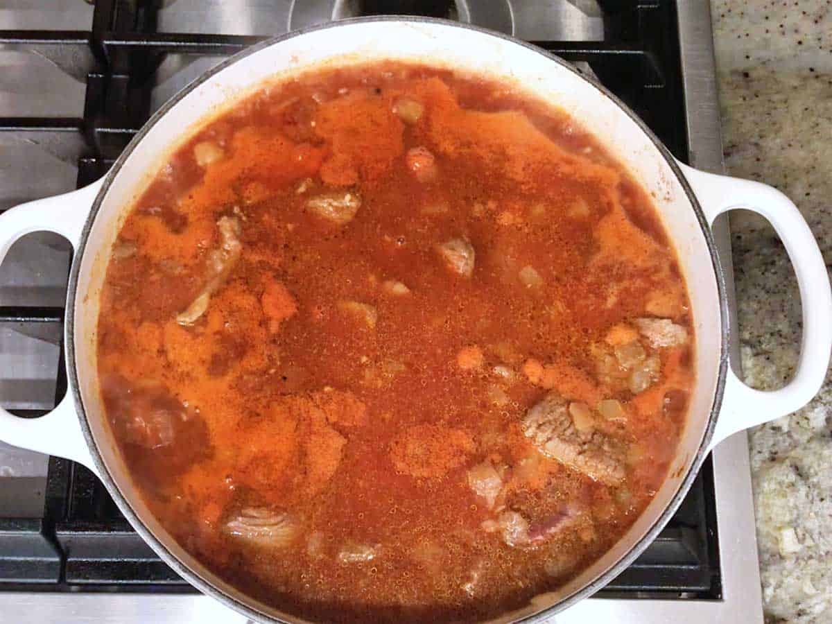 Bringing the stew to a boil.