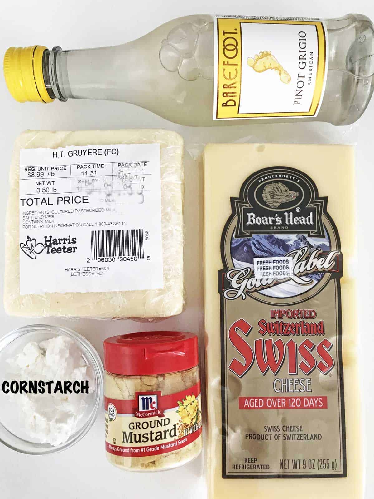 The ingredients needed to make a cheese fondue.