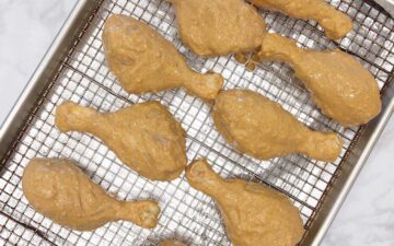 The chicken is in the pan, ready for the oven.