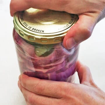 Closing the jar's lid.