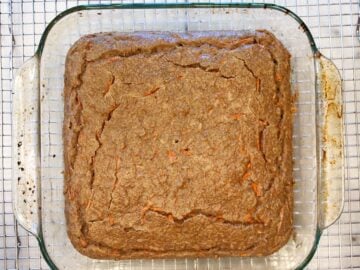 The cake is cooling on a cooling rack.