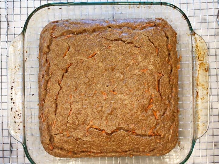 The cake is cooling on a cooling rack.