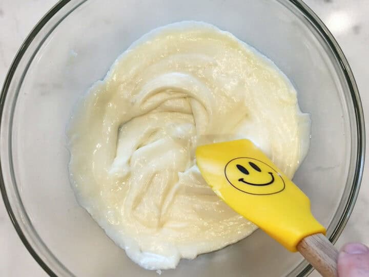 Melted cheeses in a bowl.