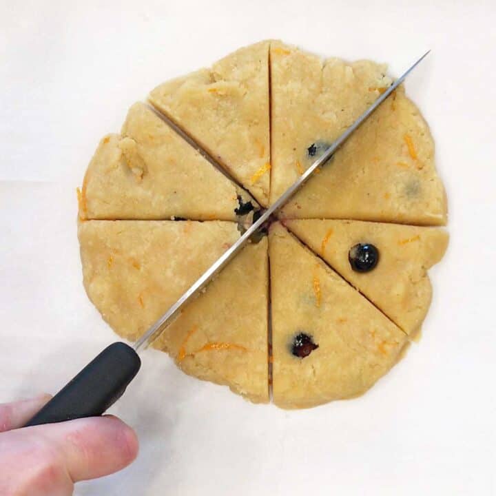 Cutting the dough into triangles.