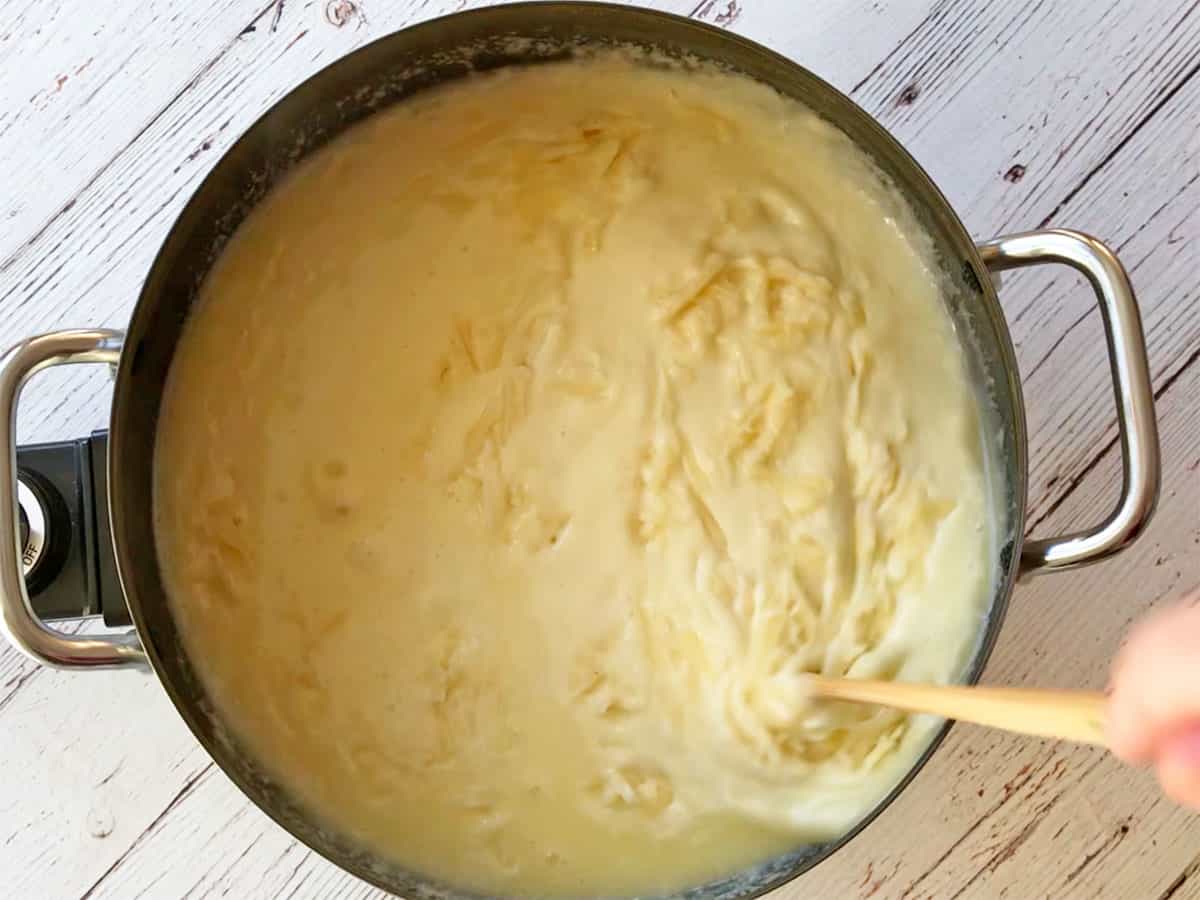 Melting cheese in the fondue pot.