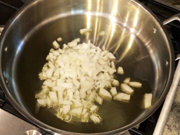 Sauteing onions in a skillet.
