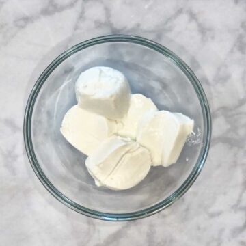 Softened cream cheese in a bowl.