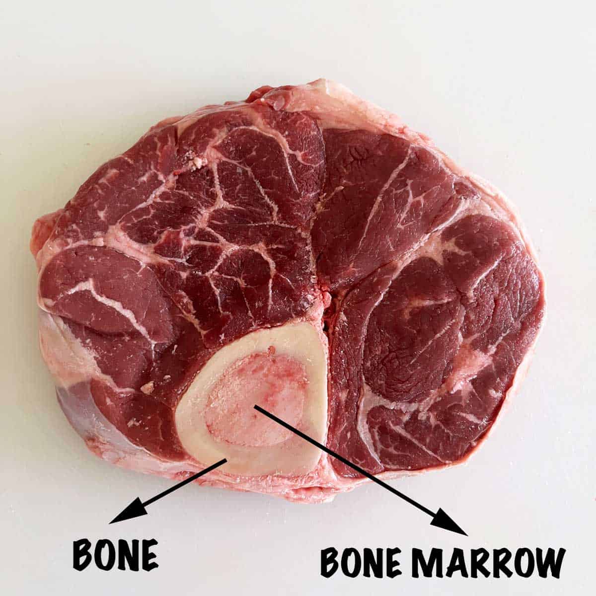 A beef shank with a bone and bone marrow in its center.