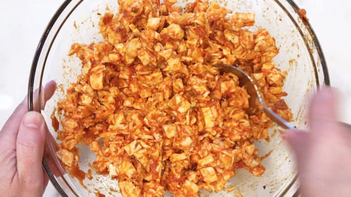 Mixing the casserole ingredients in a bowl.