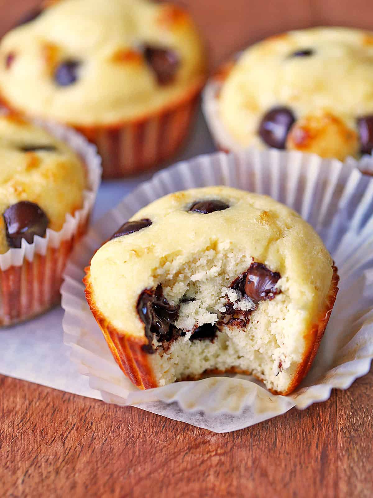 Protein muffins are served on a wooden board.