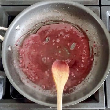 The sauce has thickened in the skillet.