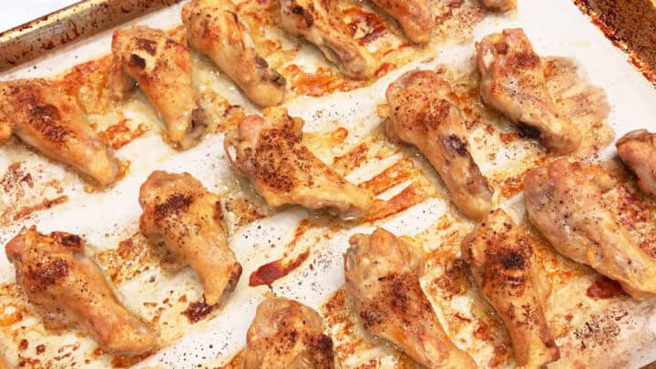 Baked wings on a baking sheet.
