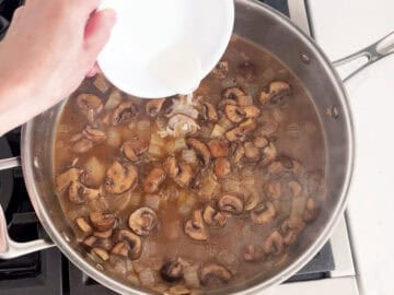 Adding cornstarch to the sauce.