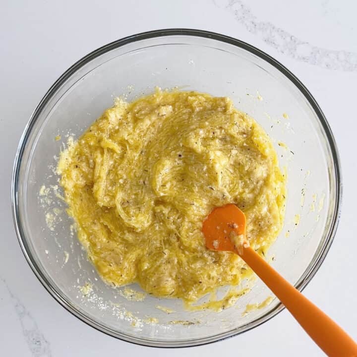 The mixture in the bowl has a thick texture.