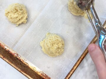 Placing the biscuits on the pan.
