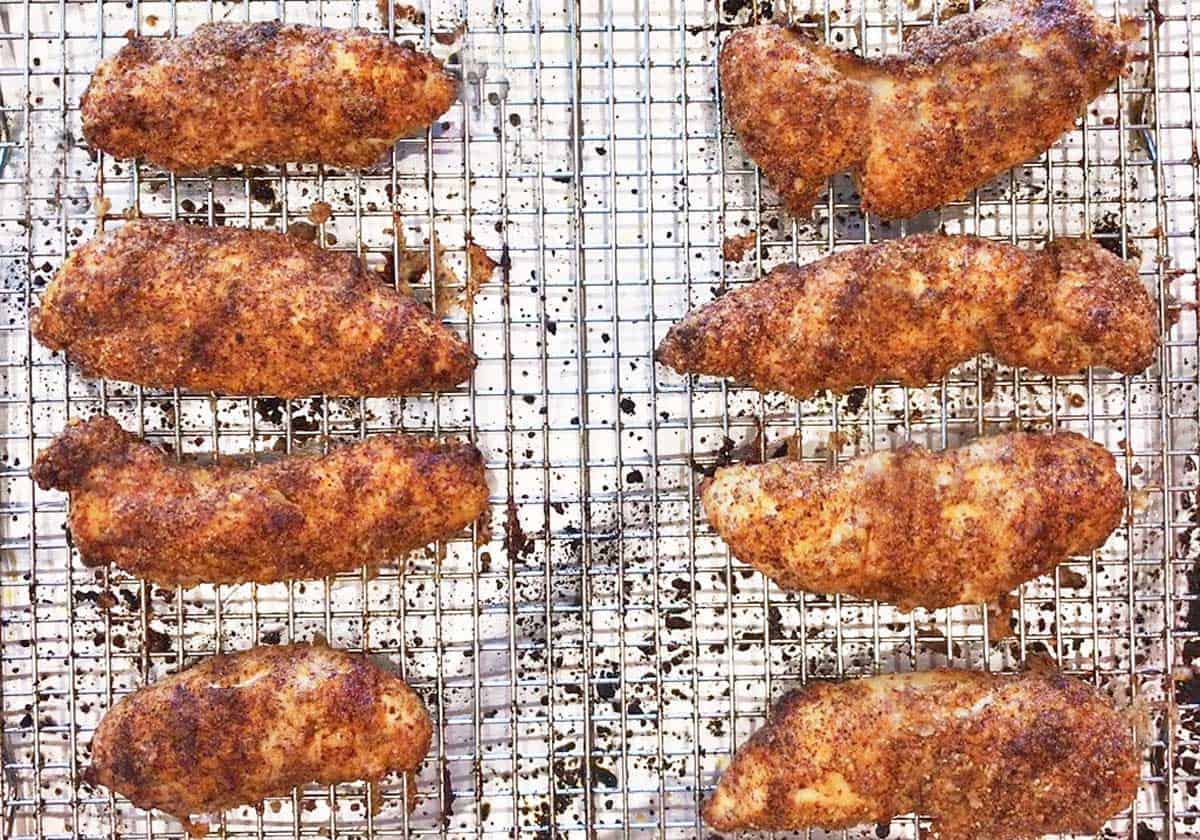 The chicken tenders are ready in the pan.