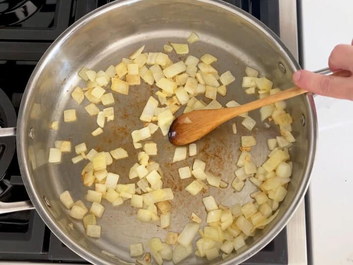 Sauteing the onions in butter.
