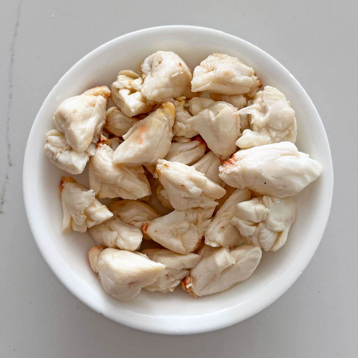Chunks of jumbo lump crab meat in a bowl.