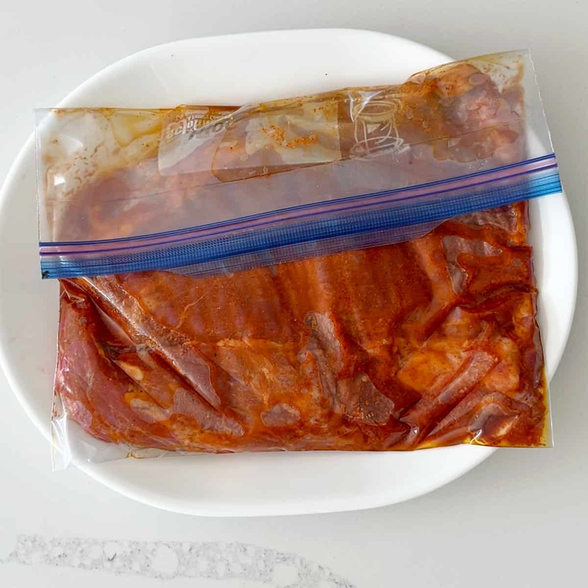 marinating the steak in a resealable bag.