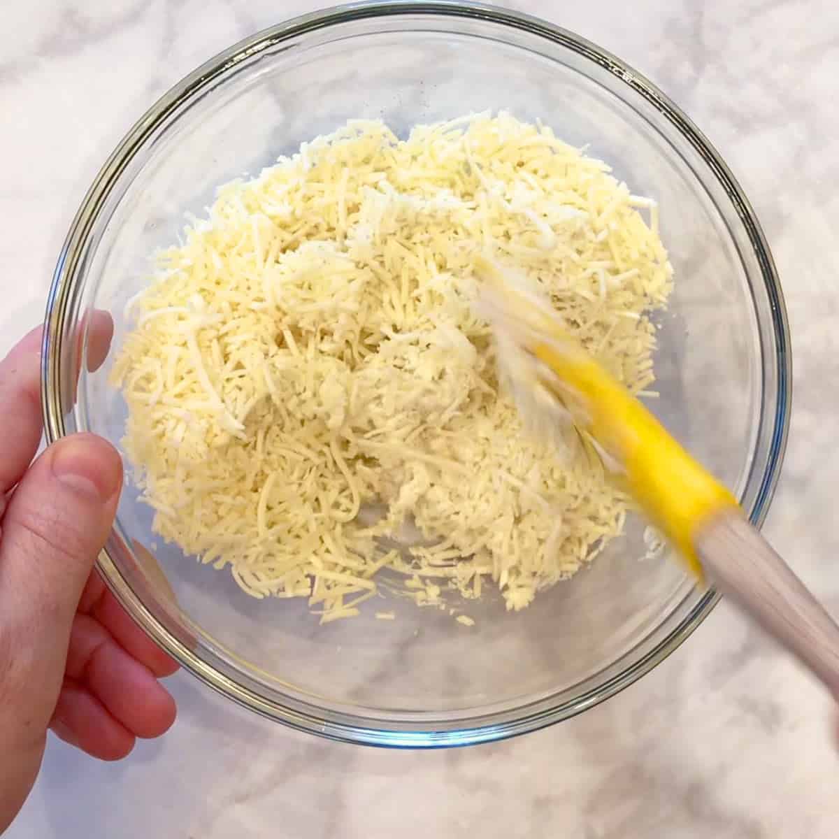 Mixing the filling in a bowl.