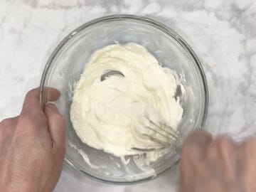 Mixing the ingredients in a bowl.