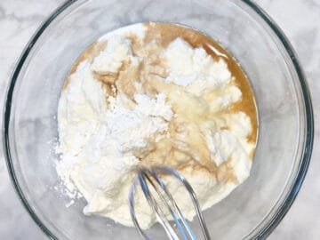 Mixing the cake ingredients in a bowl.