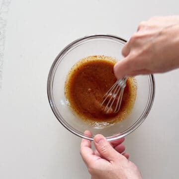 Mixing the marinade in a bowl.