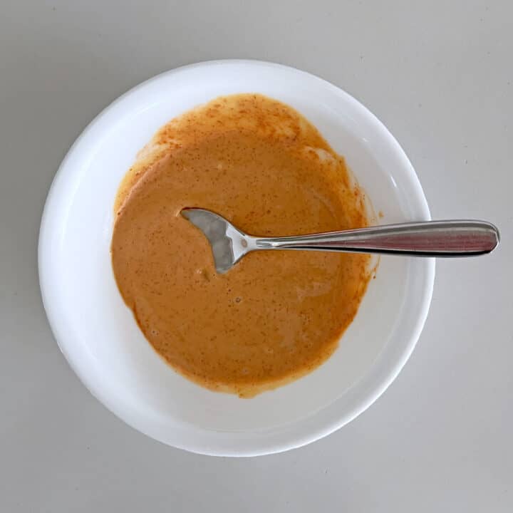 Dipping sauce for okra in a white bowl.
